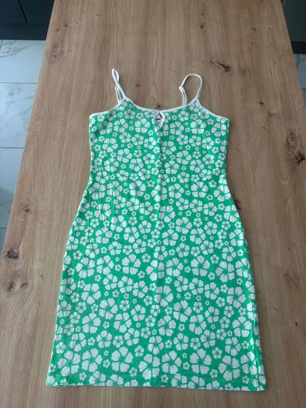 Flat-lay photo of a floral dress